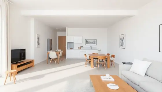 Minimalistyczny salon z jasnymi kolorami i prostymi formami